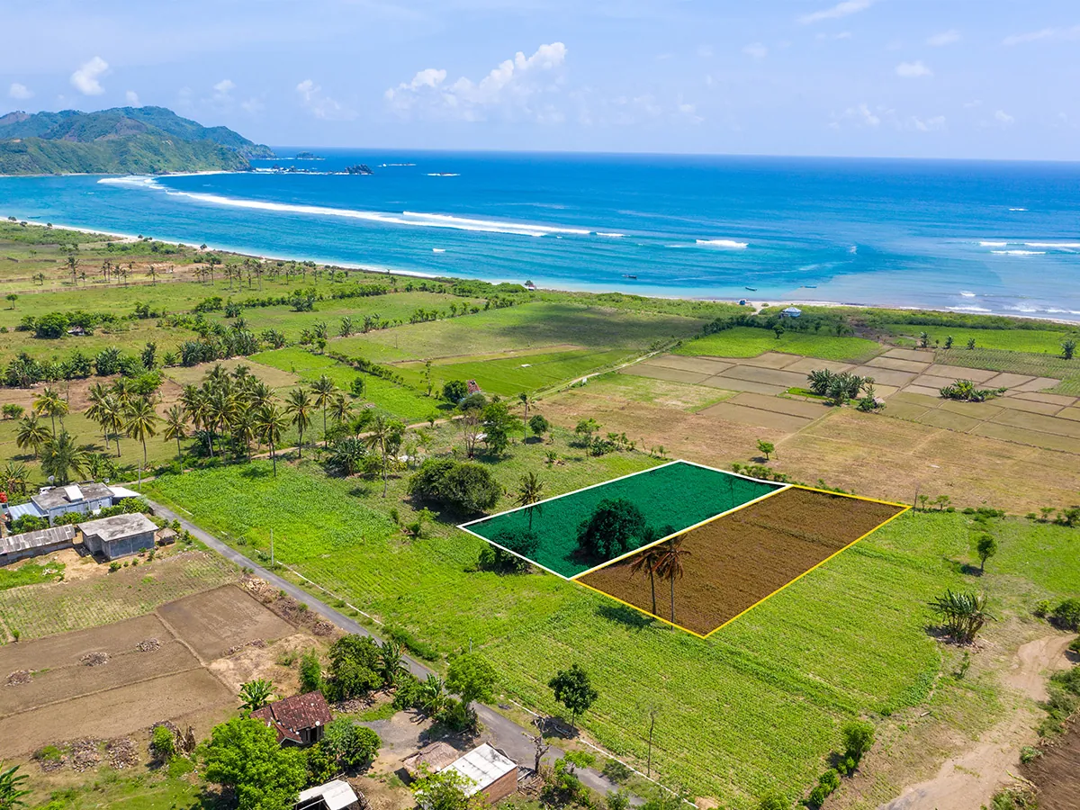 aerial drone photo of beachfront land for sale near Selong Belanak beach Lombok with plot boundary overlay